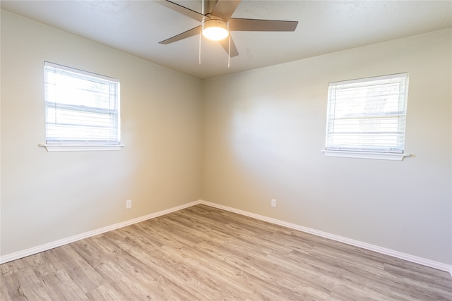 empty room featuring ceiling fan and light hardwood / wood-style flooring