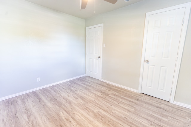 empty room featuring light hardwood / wood-style floors and ceiling fan