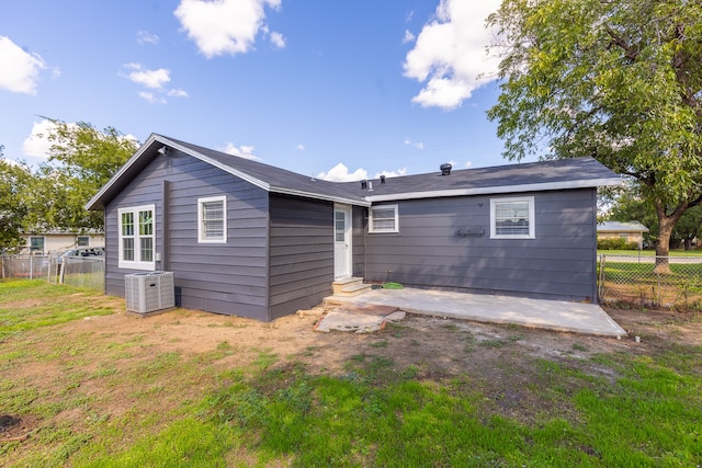 back of house with central air condition unit and a patio area