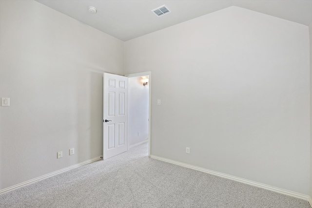 empty room featuring light carpet