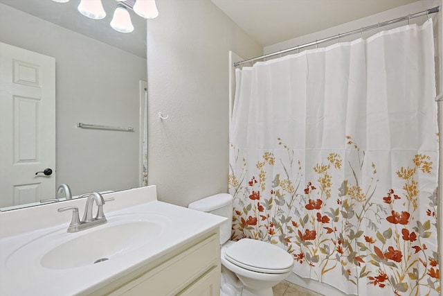 bathroom with tile patterned flooring, vanity, toilet, and a shower with shower curtain