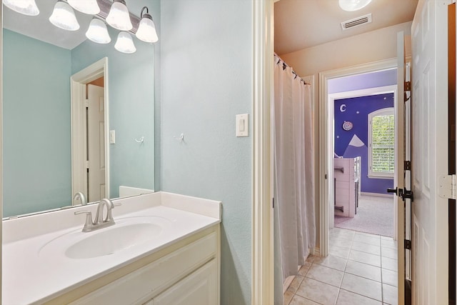 bathroom with vanity and tile patterned floors