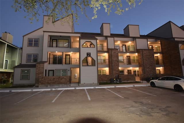 view of outdoor building at dusk