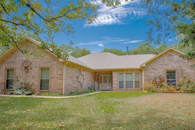 single story home featuring a front yard