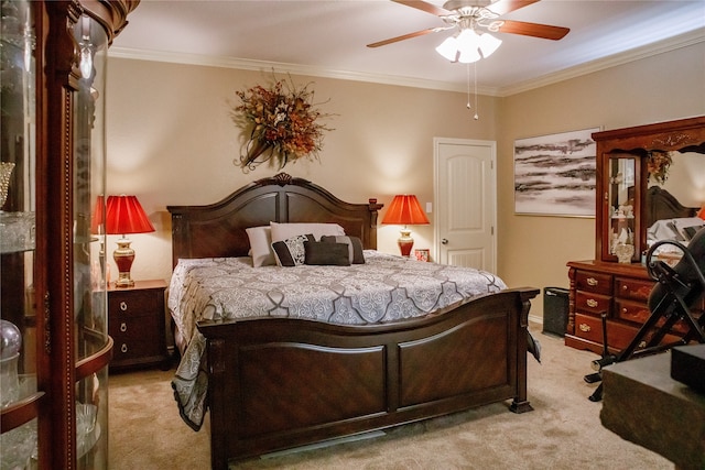 bedroom with ceiling fan, light carpet, and ornamental molding