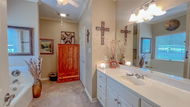 bathroom with a washtub, a wealth of natural light, ornamental molding, and vanity