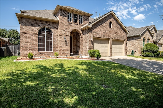 view of front of house featuring a garage and a front lawn