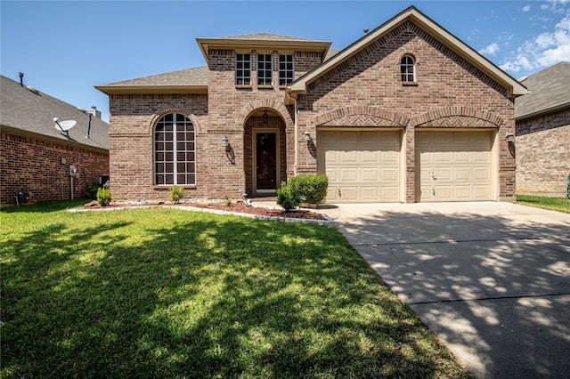 view of front facade featuring a garage and a front lawn