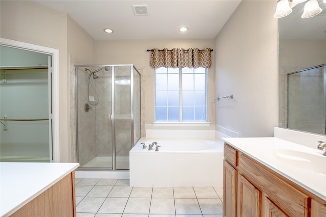 bathroom with vanity, independent shower and bath, and tile patterned flooring