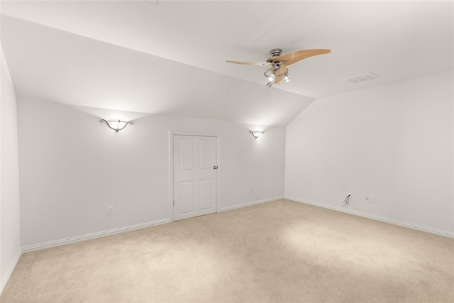 interior space with vaulted ceiling and ceiling fan