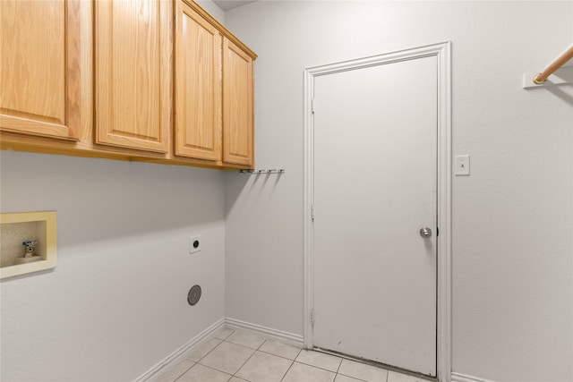 washroom featuring hookup for a washing machine, cabinets, light tile patterned flooring, and electric dryer hookup