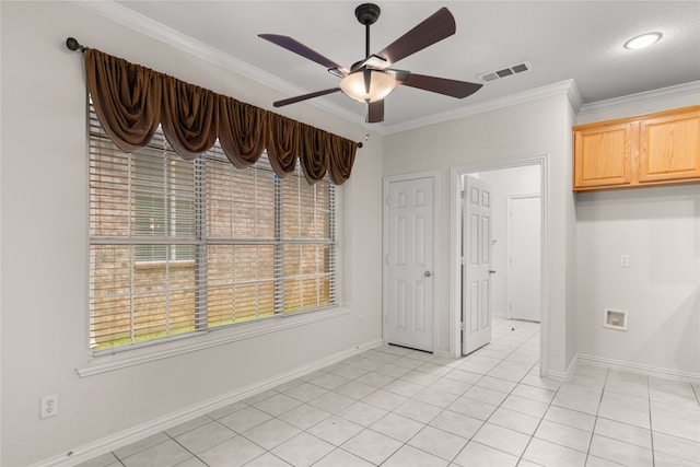 interior space featuring ornamental molding, ceiling fan, and light tile patterned flooring