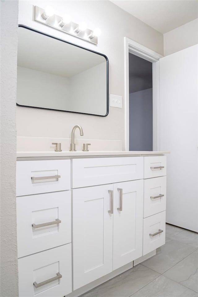 bathroom featuring vanity and tile patterned flooring