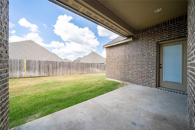 view of yard with a patio and a fenced backyard