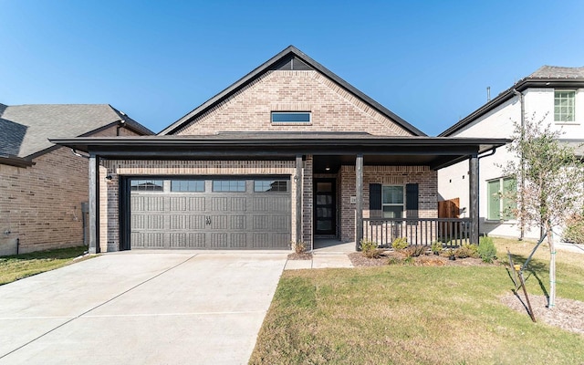 view of front of property with a porch, a garage, and a front lawn