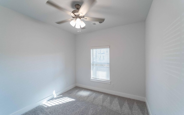 empty room with carpet flooring and ceiling fan