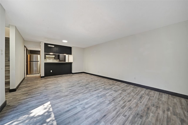 unfurnished living room featuring hardwood / wood-style floors