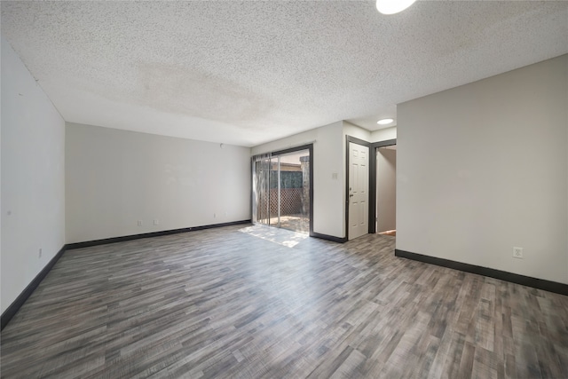 interior space featuring a textured ceiling and dark hardwood / wood-style flooring