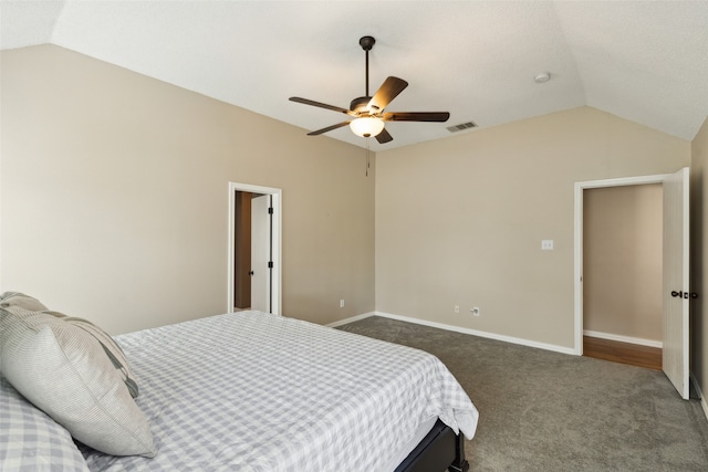 carpeted bedroom featuring vaulted ceiling and ceiling fan