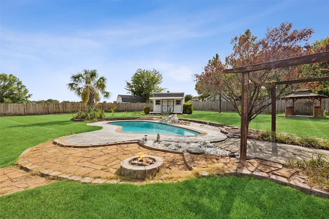 view of swimming pool with an outdoor fire pit, a fenced backyard, a yard, and a gazebo