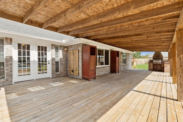 wooden terrace featuring an outdoor kitchen and french doors