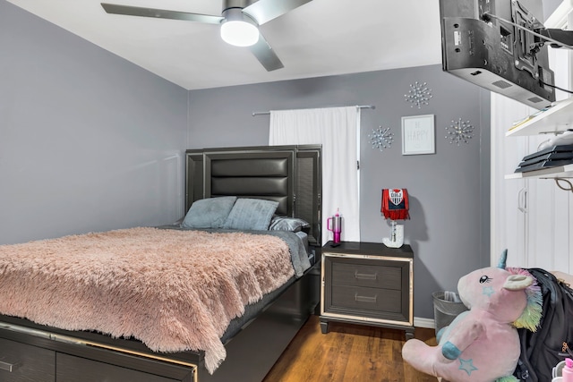 bedroom with ceiling fan and wood finished floors