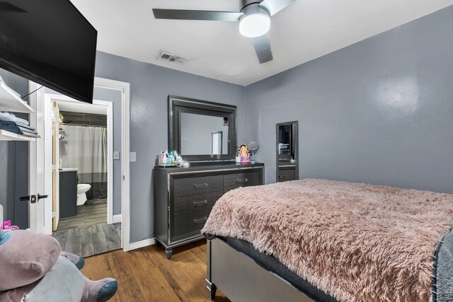 bedroom with ceiling fan and light hardwood / wood-style flooring