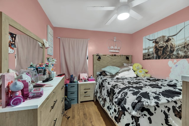 bedroom with visible vents and wood finished floors