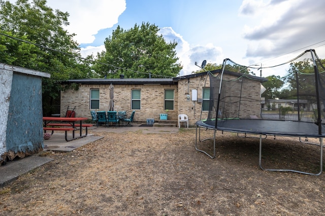 exterior space with a playground and an outdoor structure