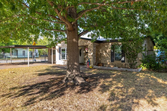 view of front of home with a carport