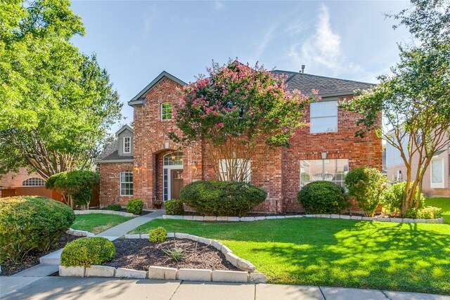 front facade featuring a front lawn