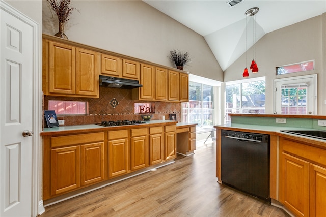 kitchen featuring pendant lighting, gas cooktop, light hardwood / wood-style flooring, backsplash, and black dishwasher