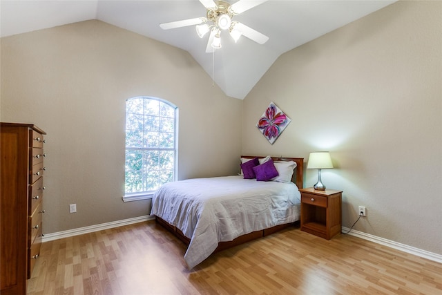 bedroom featuring a ceiling fan, light wood-type flooring, lofted ceiling, and baseboards