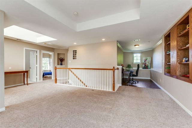 unfurnished room featuring carpet floors, recessed lighting, a raised ceiling, and baseboards