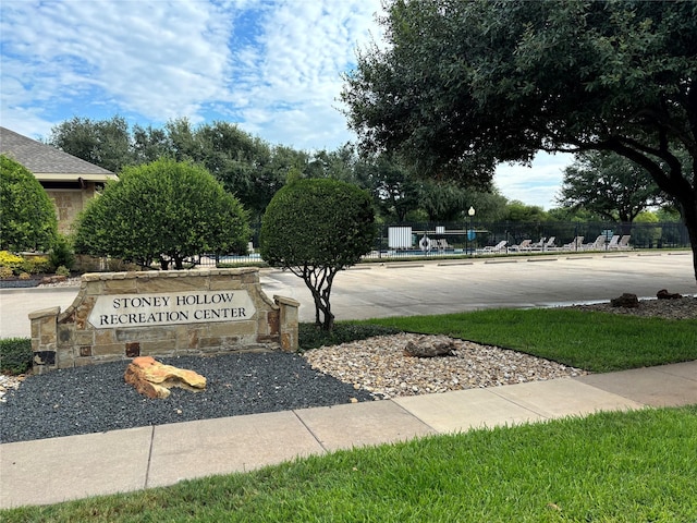 community sign with fence