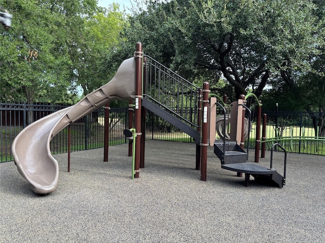 communal playground featuring fence