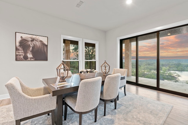 dining area featuring light wood-type flooring