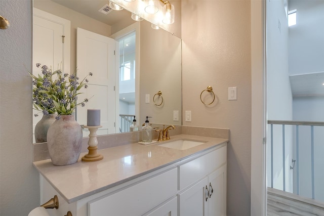 bathroom featuring wood-type flooring and vanity