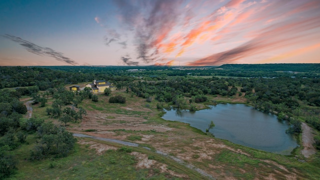 aerial view at dusk with a water view