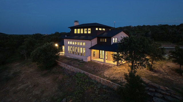 rear view of property featuring a patio