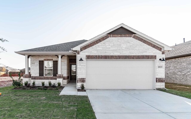 view of front of property with a porch, a garage, and a front lawn