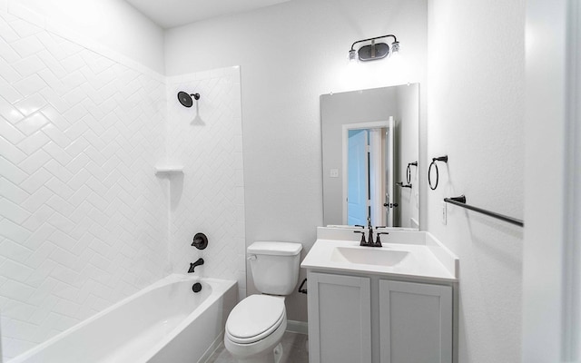 full bathroom featuring vanity, tiled shower / bath combo, and toilet