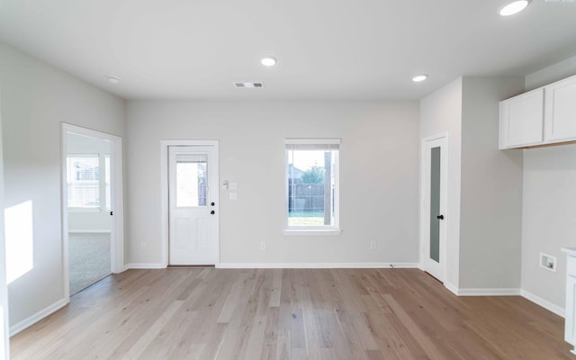 foyer with light hardwood / wood-style floors