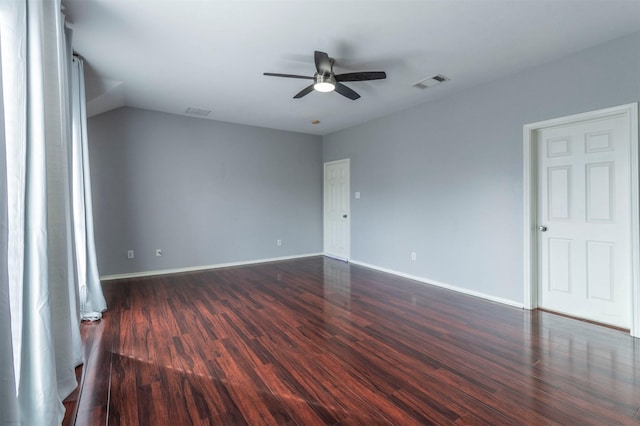 unfurnished room featuring ceiling fan and dark wood-type flooring