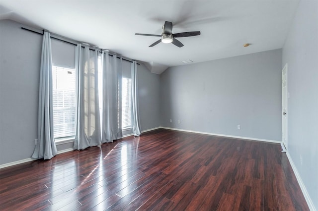 unfurnished room featuring dark hardwood / wood-style flooring, ceiling fan, and lofted ceiling