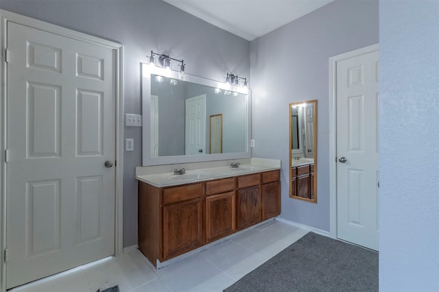 bathroom with tile patterned floors and vanity