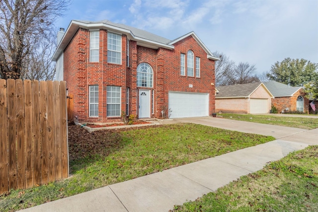 view of front facade featuring a front yard and a garage