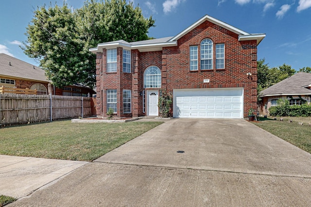 view of front of property with a front yard and a garage