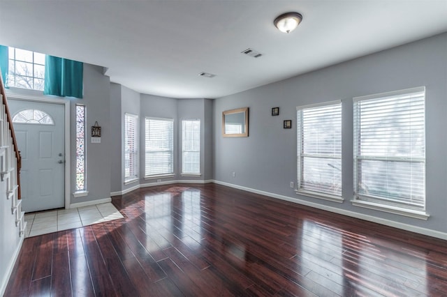 entryway with hardwood / wood-style floors