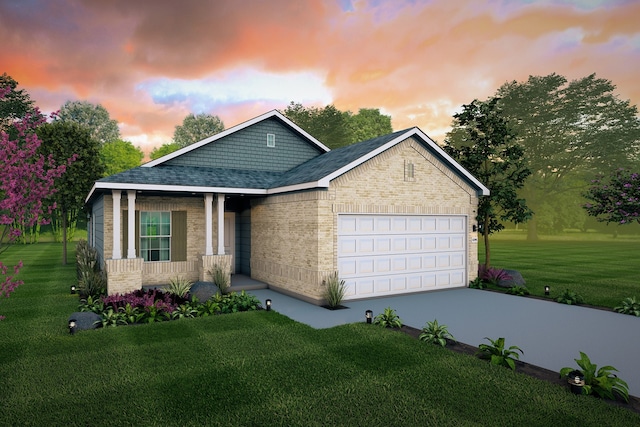 view of front of house featuring a yard and a garage